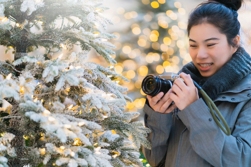woman photographing in the snow
